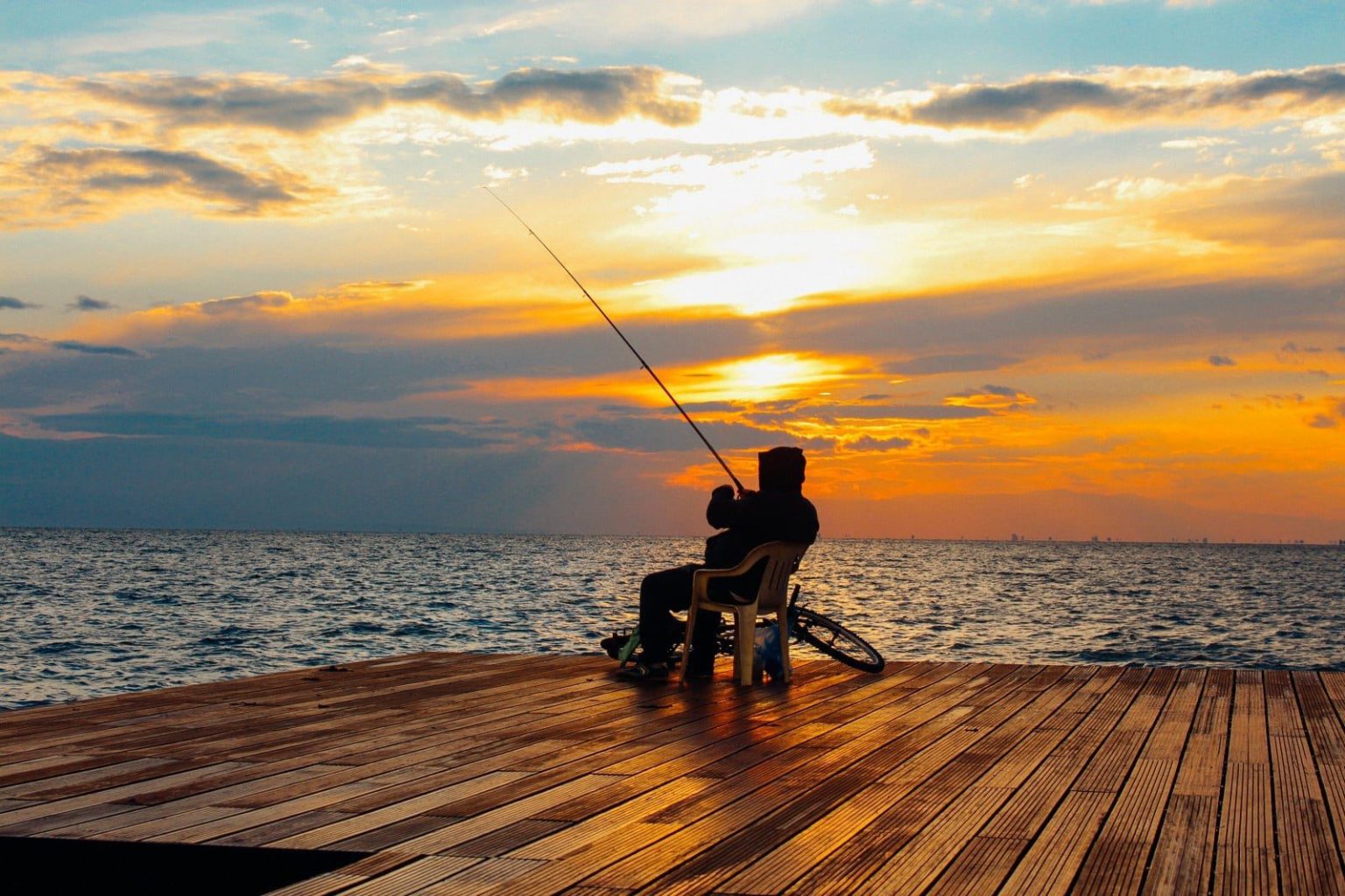 Photo of person fishing for article about phishing